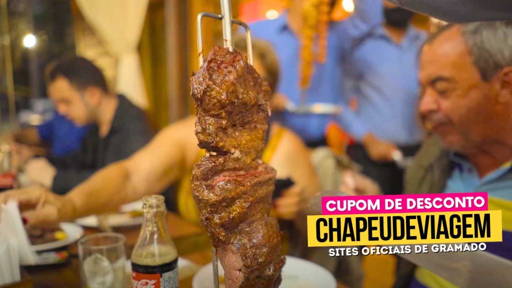 Onde almoçar em Gramado? Cupom CHAPEUDEVIAGEM até 15% OFF 13 Cupom Fundo da Grota CHAPEUDEVIAGEM - Carne no espeto, Onde Almoçar em Gramado