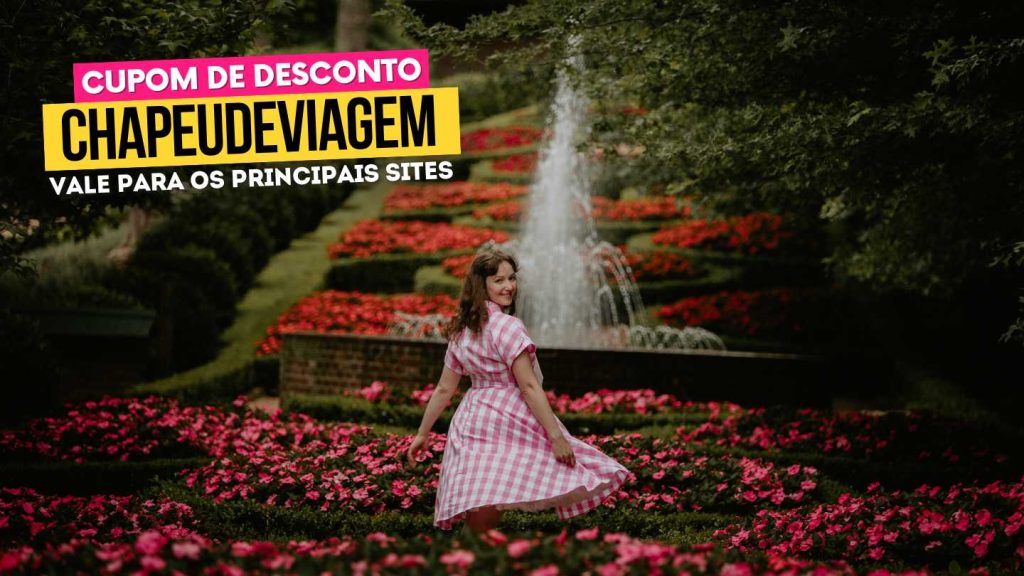Garden Park Gramado Cupom CHAPEUDEVIAGEM - Andy rodando saia do vestido rosa no meio das flores